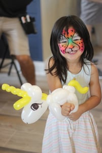 Marconi at eTown face painting and balloon animal